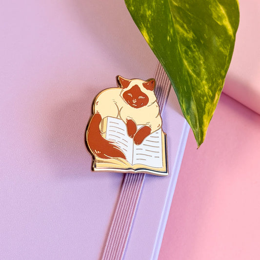 Cat on book Enamel Pin